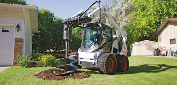 Bobcat Skid Steer with Auger attachment